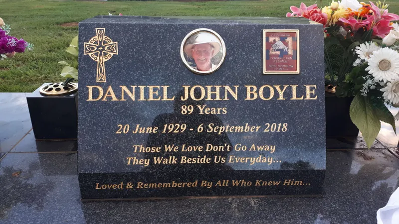 Black granite plaque with a ceramic photo, Celtic cross and gold lettering
