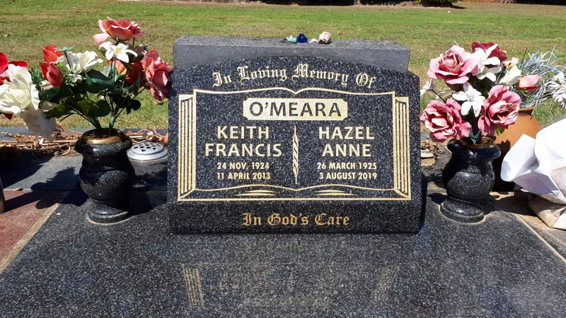Black granite double desk plaque with gold lettering and vases