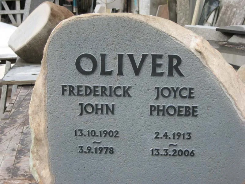 Rustic natural stone headstone with engraved lettering