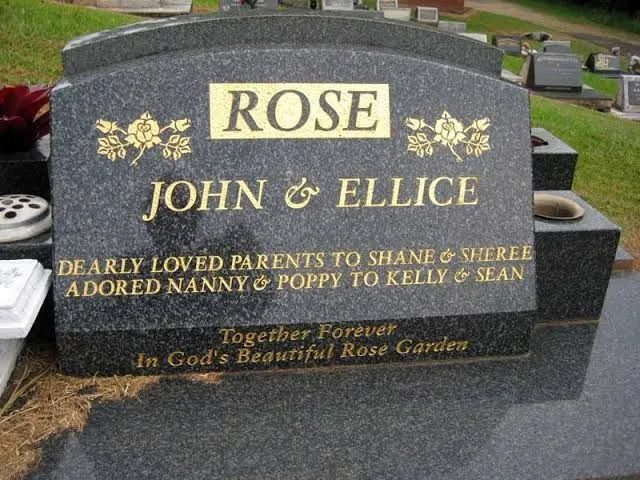 Grey granite double headstone with gilded rose detail