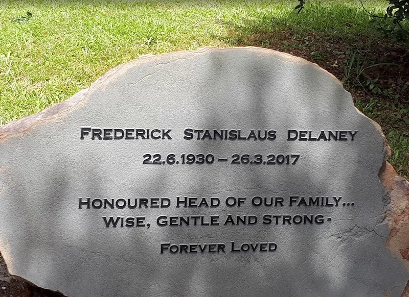 Basalt memorial for Frederick Stanislaus Delaney with raised lettering