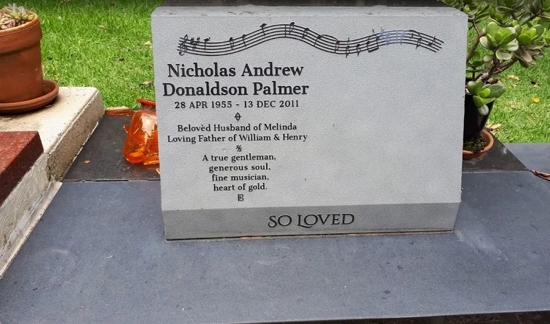 Front view of the desk headstone for Nicholas Andrew Donaldson Palmer with a raised inscription