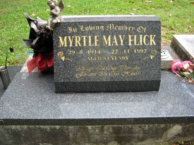 Dark granite desk memorial with gold script lettering